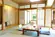 【本館角部屋 客室一例】（温水洗浄トイレ付）窓の外には清流・宝川が流れるております。