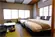 ゆったりセミダブルベッドを２台設置した和洋室タイプのお部屋です。落ち着きのあるインテリア、広めの空間で寛ぎのひとときをお過ごしください。※ 和洋室タイプは、トイレ付き（ウォシュレット）、バスなしとなります。