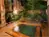Private outdoor family onsen "Shinano-buro".  Garden features a shinanoki tree, the namesake of Nagano's classical title -- Shinano.  Trimmed in hinoki cypress for an elegant, secluded bath.